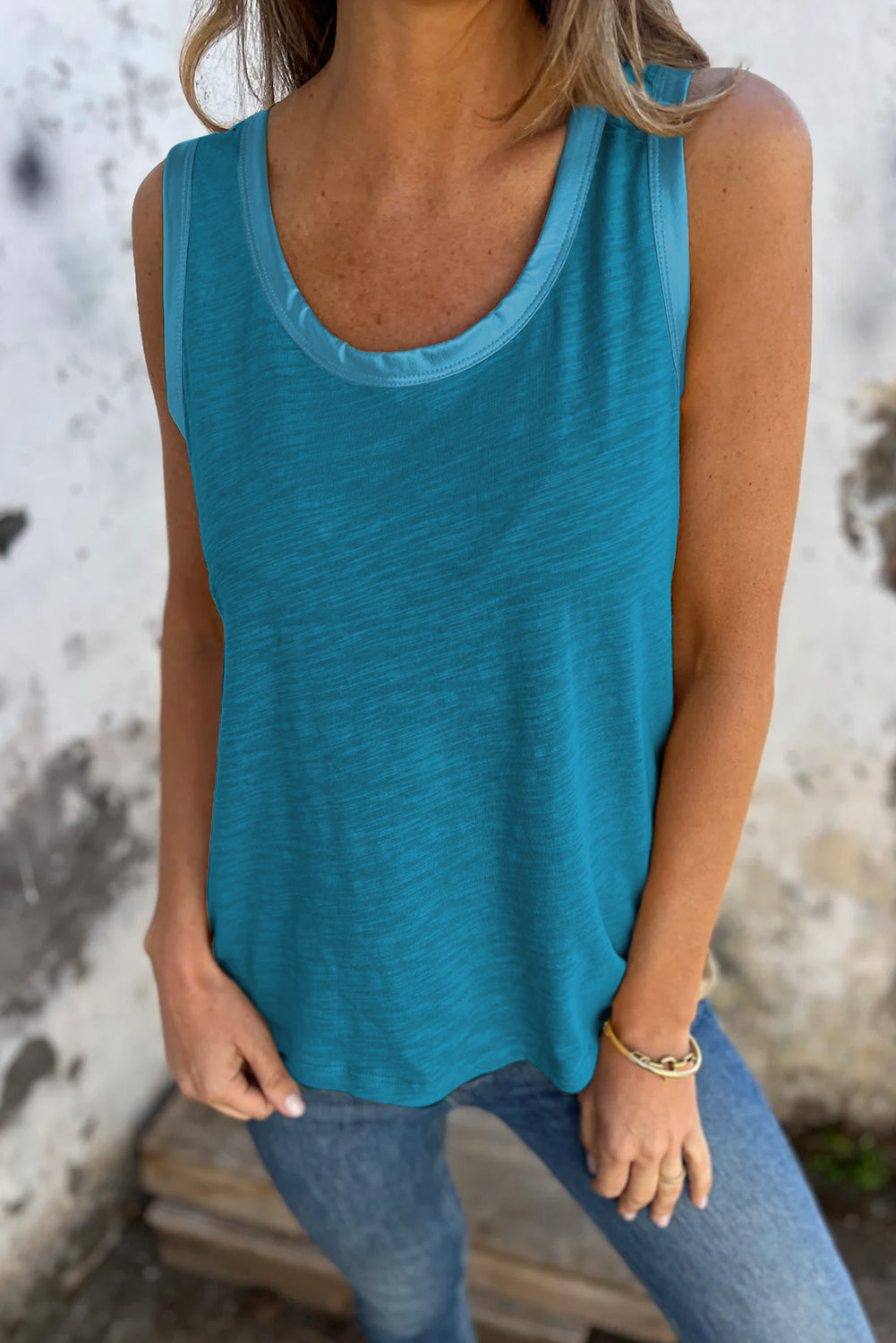 Bold color, subtle shine. This scoop neck tank in a rich peacock blue features a gleaming metallic sheen edge that catches the light in all the right ways