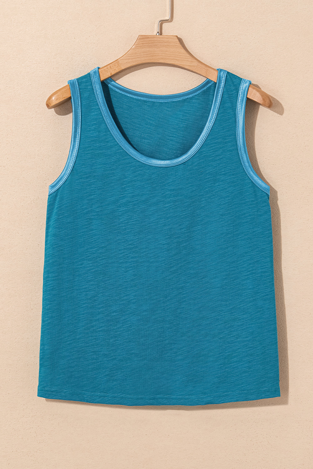 Bold color, subtle shine. This scoop neck tank in a rich peacock blue features a gleaming metallic sheen edge that catches the light in all the right ways