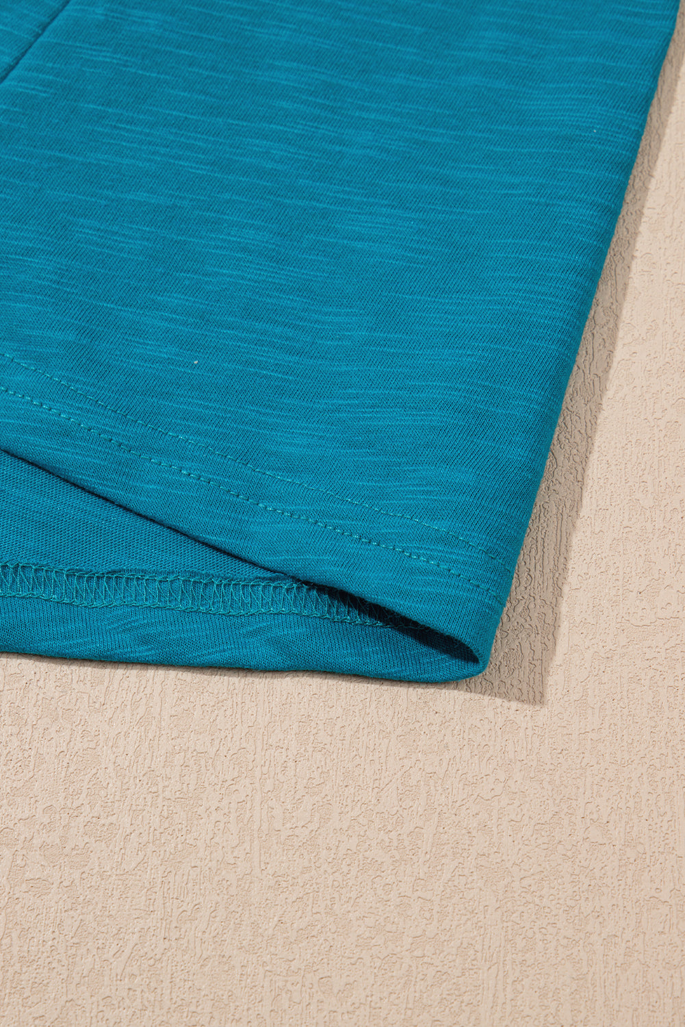 Bold color, subtle shine. This scoop neck tank in a rich peacock blue features a gleaming metallic sheen edge that catches the light in all the right ways
