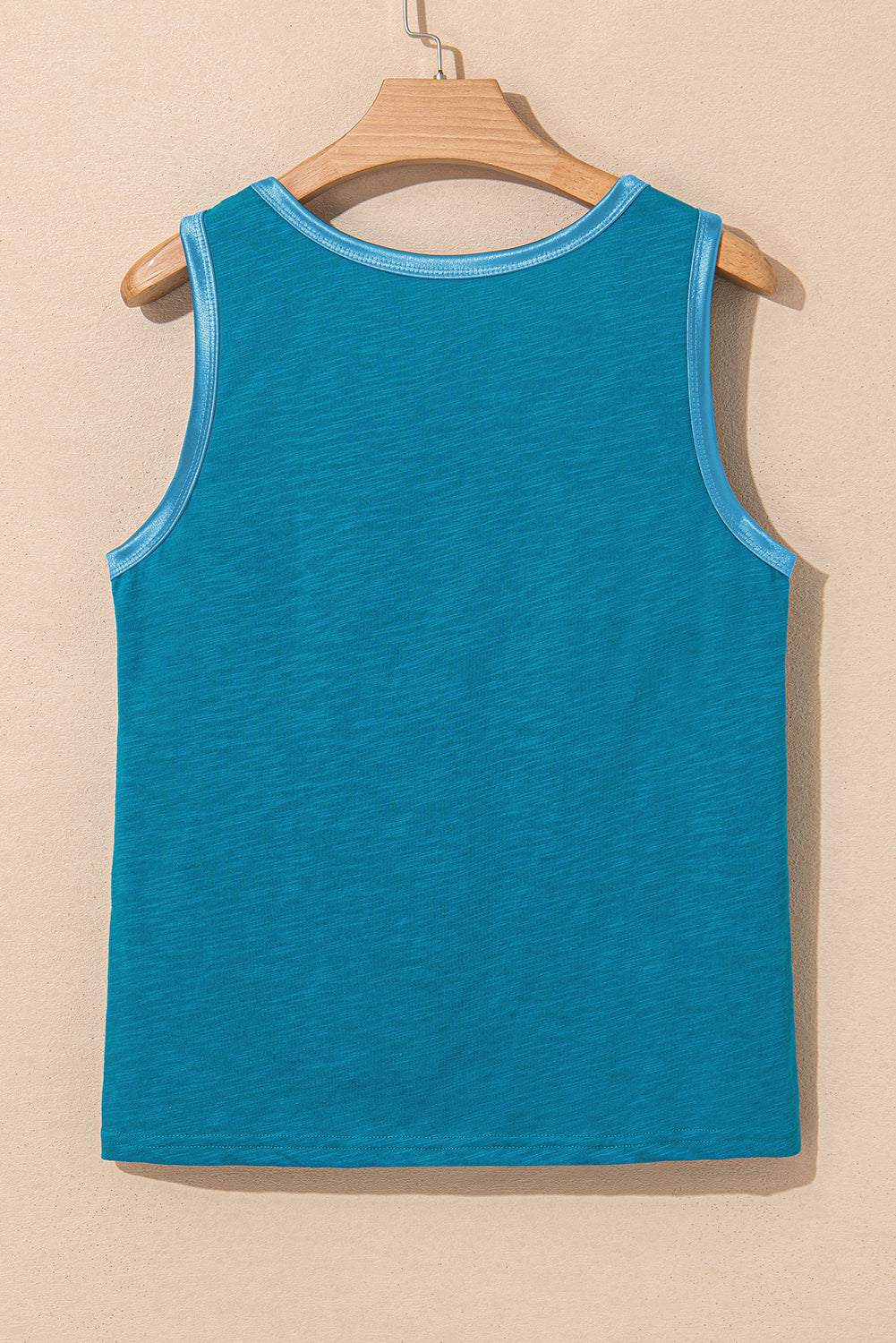 Bold color, subtle shine. This scoop neck tank in a rich peacock blue features a gleaming metallic sheen edge that catches the light in all the right ways