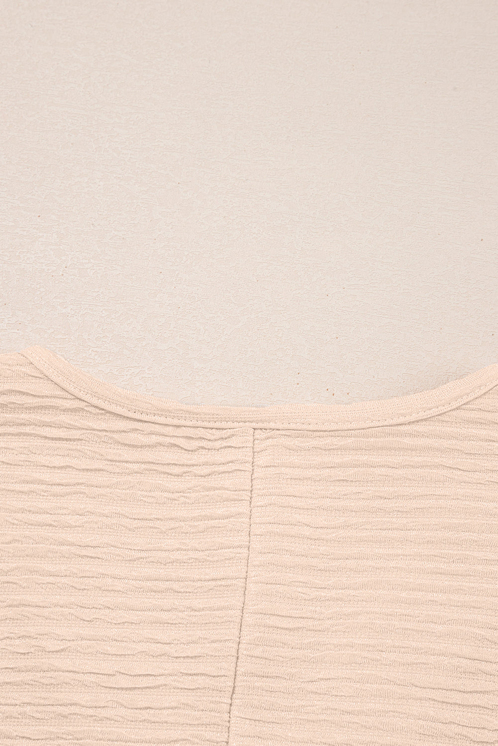 Warm tones, cool vibes. This textured V-neck tee and shorts set in a soft apricot is the matching set made for summe