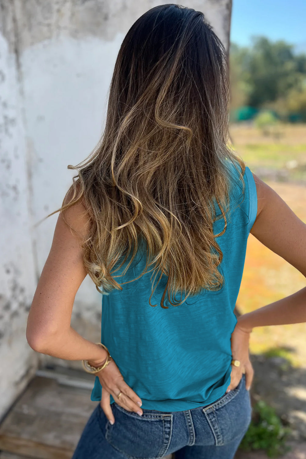 Bold color, subtle shine. This scoop neck tank in a rich peacock blue features a gleaming metallic sheen edge that catches the light in all the right ways